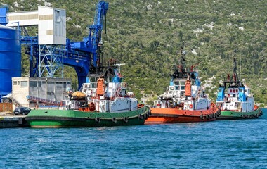 Row of tugboats docked in the port of Ploce in Croatia.