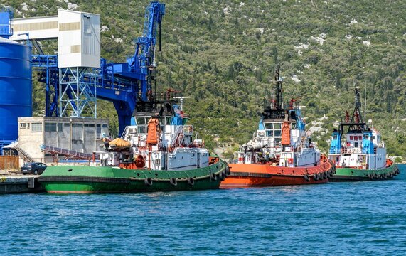 Row of tugboats docked in the port of Ploce in Croatia.