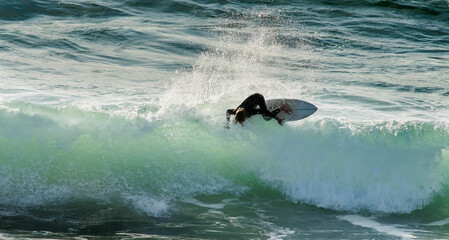 Surfer battling the swell in the southwest of France