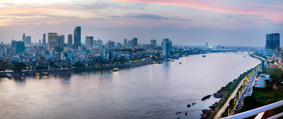 Sunset over Phnom Penh and the Royal Palace,viewed from eastern side of Tonle Sap river,Cambodia.
