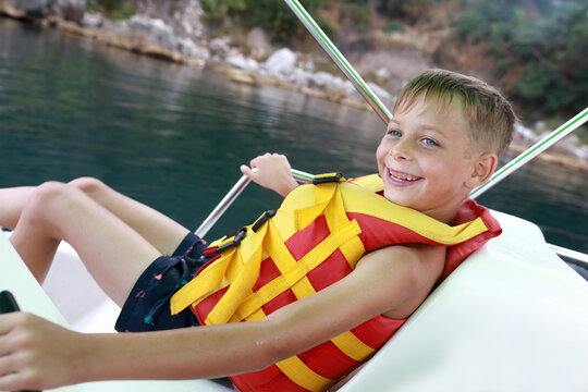 Child relaxing on catamaran