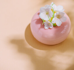 Pink mousse cakes decorated with white flowers