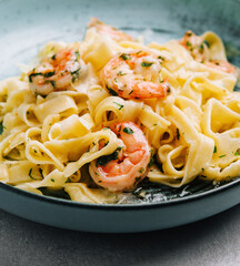 Italian pasta fettuccine or tagliatelle with shrimps