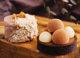 Sweet chocolate tart dessert and mini Kyiv cake