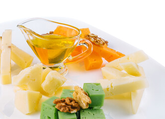 Cheese Platter with Honey, Nuts on white plate