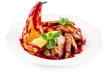 Fried duck fillet with pear on a plate