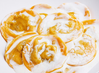 Boiled ravioli with sour cream on plate