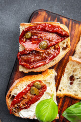 sun-dried tomato bruschetta healthy meal food snack on the table copy space food background rustic top view keto or paleo diet veggie vegan or vegetarian food