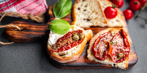 sun-dried tomato bruschetta healthy meal food snack on the table copy space food background rustic top view keto or paleo diet veggie vegan or vegetarian food