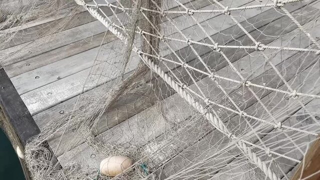 coil of old brown nautical rope close-up