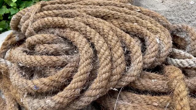 old marine fish rope net with floats sways in the wind