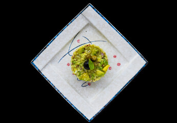 Vegetarian zucchini and avocado tartare with olive