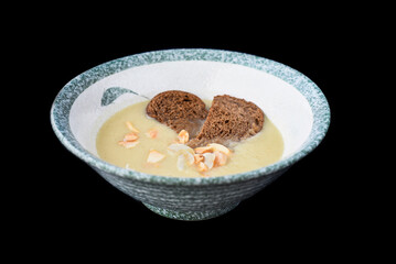 Vegetarian chestnut soup with black bread isolated for a menu