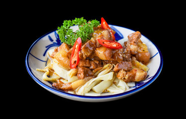 Vietnamese fried pork with ginger on black background