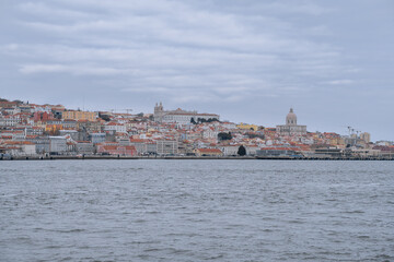 Obraz premium View of the Alfama district in Lisbon from the Tagus River (Portugal). 