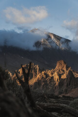 Landscape with mountains in the background and a cloudy evening day