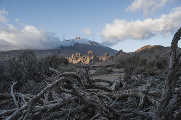 Landscape with mountains in the background and a cloudy evening day