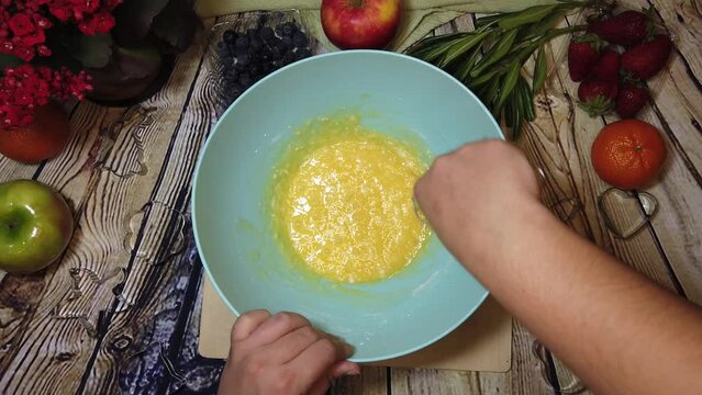Making omlet or cake preparation. Overhead shot, cooking, food prep. High quality 4k footage