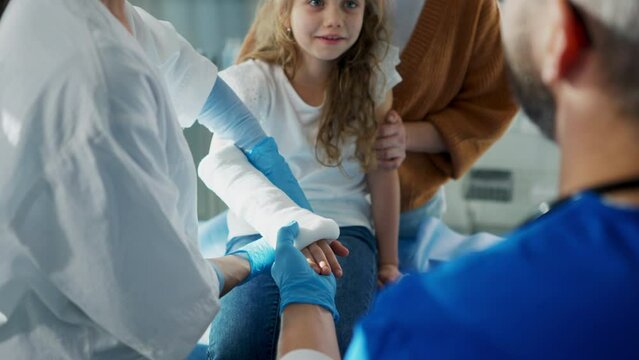 Girl with her mother in surgery examination.