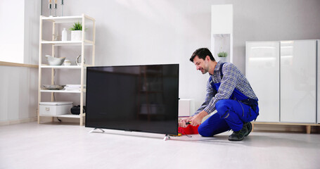 Electrician Repairing Television Or TV Appliance