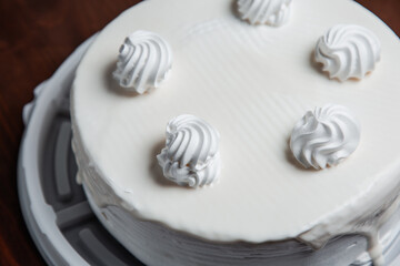 Biscuit baked cake with cream. Pastry.