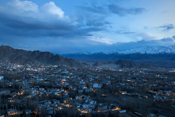 A late evening view of Leh town from a hilltop perch is an awe-inspiring sight to behold. In blue hour, blue and golden light play a magical moment.