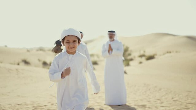Three generation family spending time in the desert making a safari in Dubai. Concept about middle eastern cultures and lifestyle in the emirates
