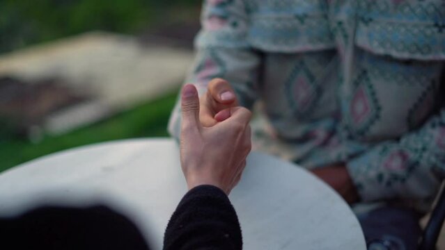 Closeup of Two Men Thumb War Fun Competitive Competition Fight Fair Play in the garden