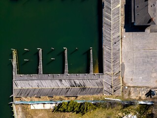 aerial view of a boat dock at the ocean near buildings