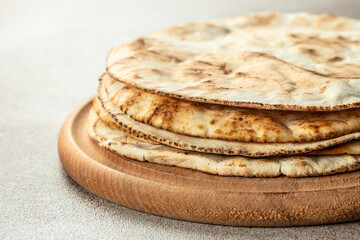 Homemade wheat tortillas, pita bread, tortilla, pita. Traditional Arabic cuisine. banner, menu, recipe place for text, top view