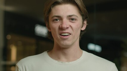 Shocked amazed guy looking at camera surprised Caucasian man client open mouth astonish shock wonder male student astonish reaction on news win. Portrait expressive delighted customer in shopping mall