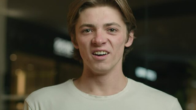 Shocked amazed guy looking at camera surprised Caucasian man client open mouth astonish shock wonder male student astonish reaction on news win. Portrait expressive delighted customer in shopping mall