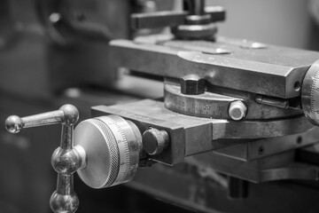 Grayscale closeup shot of a turning machine.