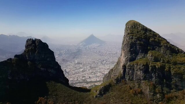 Aerial of the Pico Sur and Pico Norte mountains with the with the Monterrey cityscape in background