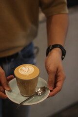 latte art on te wood table in the coffee shop