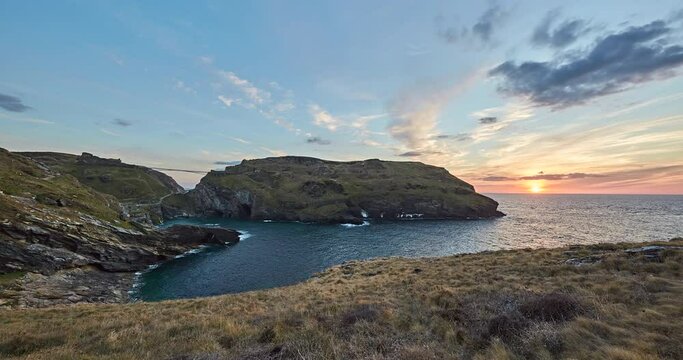 Time Lapse of Tintagel Castle at sunset, this is a medieval fortification adjacent to the village of Tintagel, The ruined Castle has a long association with lengends to King Arthur, Cornwall, UK