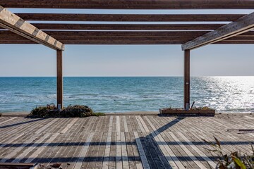 Fototapeta premium Wooden patio with a view of the ocean