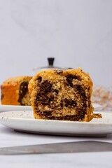 Piece of freshly baked biscuit cake on a plate