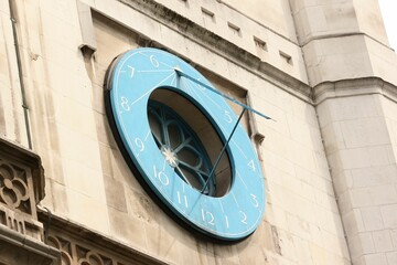 Sundial clock on the south side of St Margaret's, Westminster.
