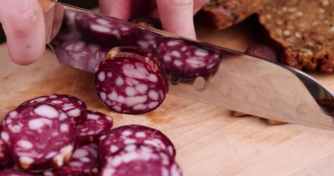sliced high-quality pork sausage with the addition of lard pieces, ready-made food products with the use of pork meat
