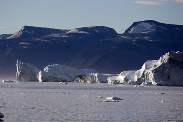 Iceberg with arc in Uummannaq fjord, Greenland, Denmark  