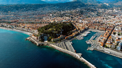 Fototapeta na wymiar Nice, France beautiful aerial cityscape and panoramic view of harbor with luxury yachts, cruise ship in the French Riviera the southeastern coast of France on the Mediterranean Sea from above 5.5K UHD