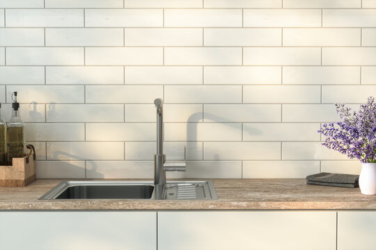 A sleek kitchen countertop perfect for product display, adorned with olive oil and lavender, featuring a white mosaic backsplash and a gorgeous sink and faucet set, with morning sunlight. 3d rendering