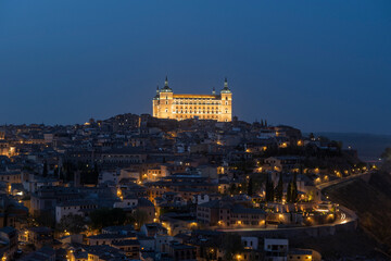 Fototapeta na wymiar Toledo, Spain - April 9, 2023: Panoramic view of the city of Toledo at night, The Alcazar
