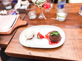 
Petit Gateau dessert plate in a restaurant.