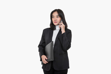 Fototapeta premium Happy Asian business woman making a phone call with a business partner on isolated on white background