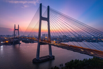Fototapeta premium Sunset on Phu My bridge, Saigon river, Ho Chi Minh city, Vietnam