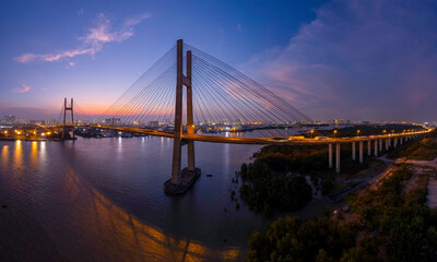 Fototapeta na wymiar Sunset on Phu My bridge, Saigon river, Ho Chi Minh city, Vietnam
