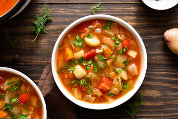 Cabbage soup in bowl, top view