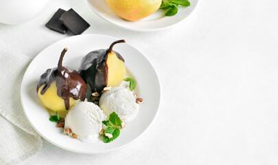 Poached pears with chocolate sauce and ice cream